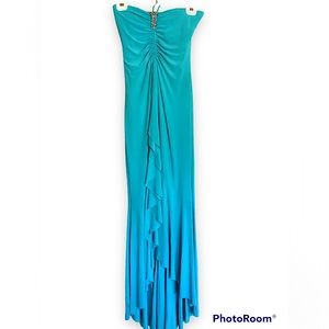 New With Tags! A beautiful formal turquoise blue dress.
